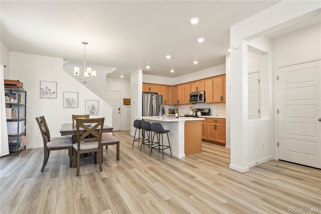 23920 E 34th Ave, Aurora, CO 80019 - dining room with light wood-style flooring, recessed lighting, a chandelier, and baseboards