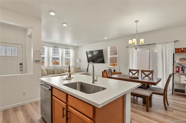 23920 E 34th Ave, Aurora, CO 80019 - kitchen featuring a sink, open floor plan, dishwasher, light countertops, and recessed lighting
