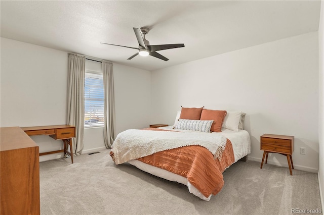 23920 E 34th Ave, Aurora, CO 80019 - bedroom featuring light carpet, baseboards, and a ceiling fan