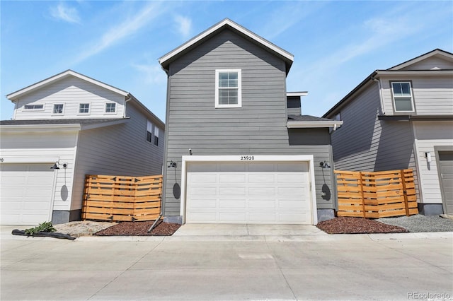 23920 E 34th Ave, Aurora, CO 80019 - view of front of home with driveway and an attached garage