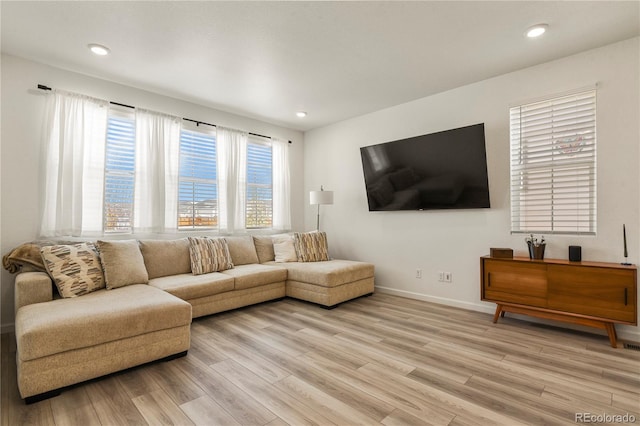 23920 E 34th Ave, Aurora, CO 80019 - living room featuring light wood-type flooring, baseboards, and recessed lighting