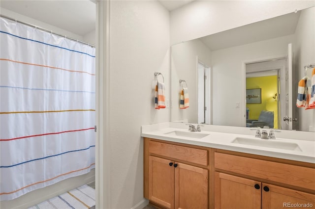 23920 E 34th Ave, Aurora, CO 80019 - ensuite bathroom with double vanity and shower / tub combo with curtain