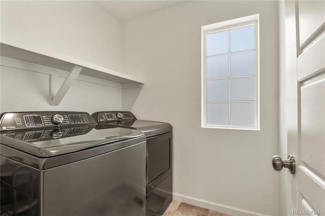 23920 E 34th Ave, Aurora, CO 80019 - washroom featuring washing machine and dryer and baseboards