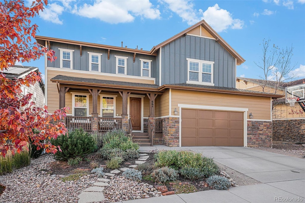 craftsman-style house featuring a garage and covered porch