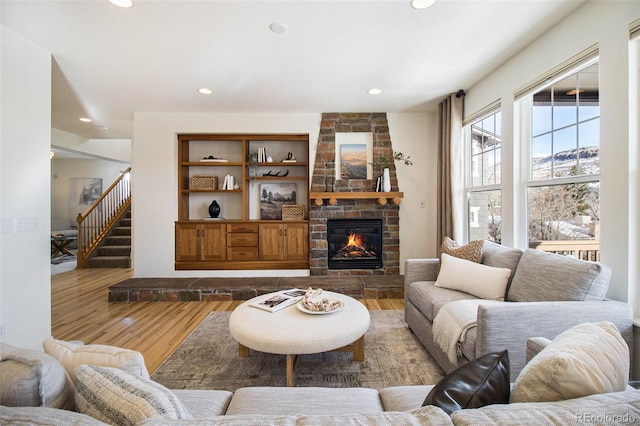 living room featuring hardwood / wood-style flooring and a fireplace