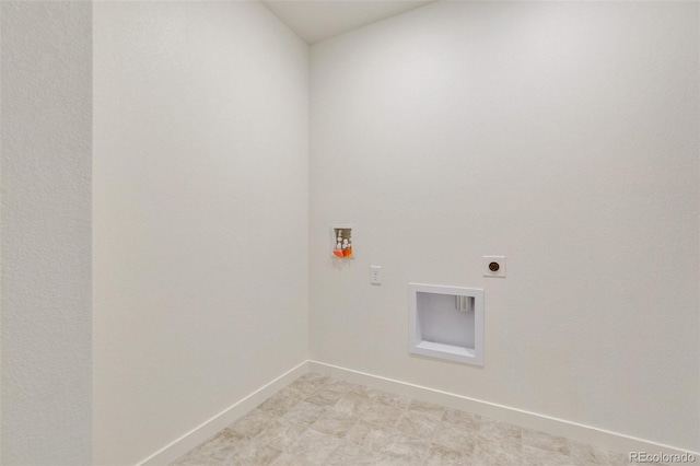 laundry room featuring electric dryer hookup, hookup for a washing machine, and baseboards