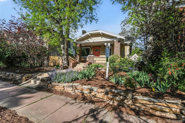 1633 Gaylord St, Denver, CO 80206 - view of front of home with a porch and brick siding