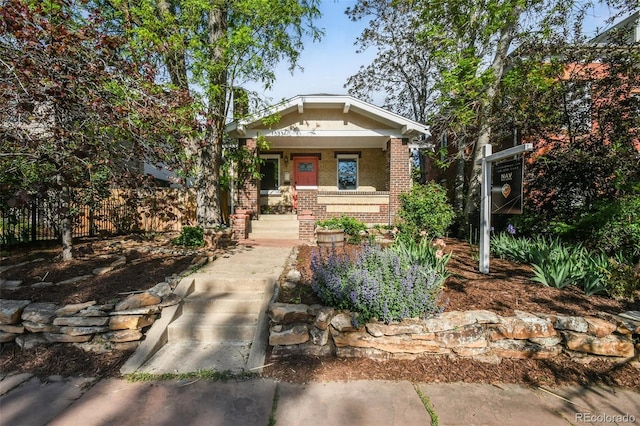 1633 Gaylord St, Denver, CO 80206 - bungalow-style home with brick siding and a porch