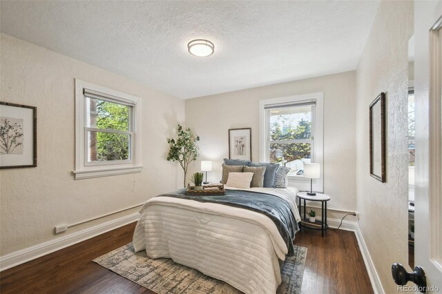 1633 Gaylord St, Denver, CO 80206 - bedroom with baseboards, wood finished floors, and a textured ceiling