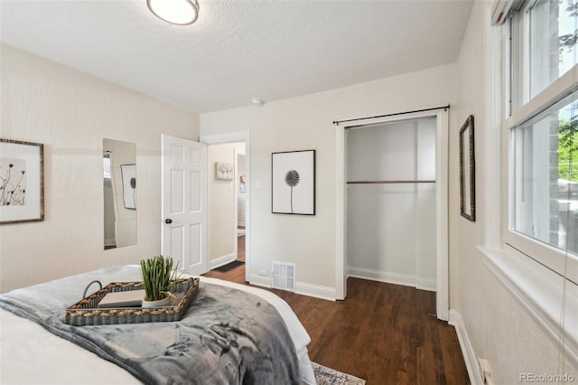 1633 Gaylord St, Denver, CO 80206 - bedroom featuring wood finished floors, baseboards, and a textured ceiling