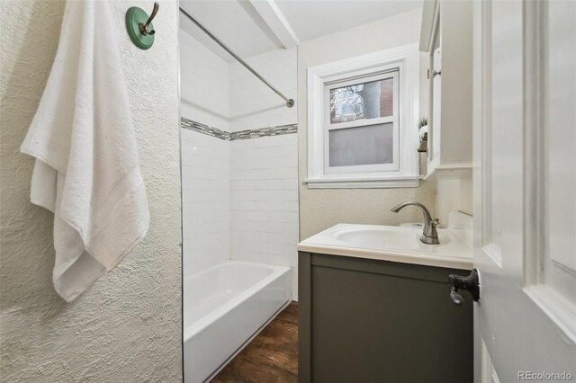 1633 Gaylord St, Denver, CO 80206 - bathroom featuring a textured wall,  shower combination, and vanity