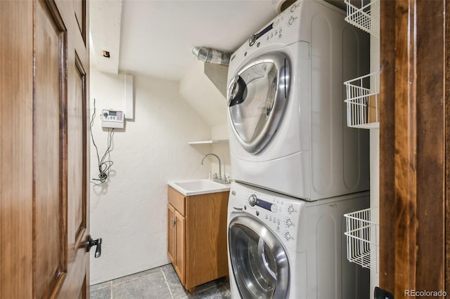 1633 Gaylord St, Denver, CO 80206 - clothes washing area featuring stacked washer / dryer