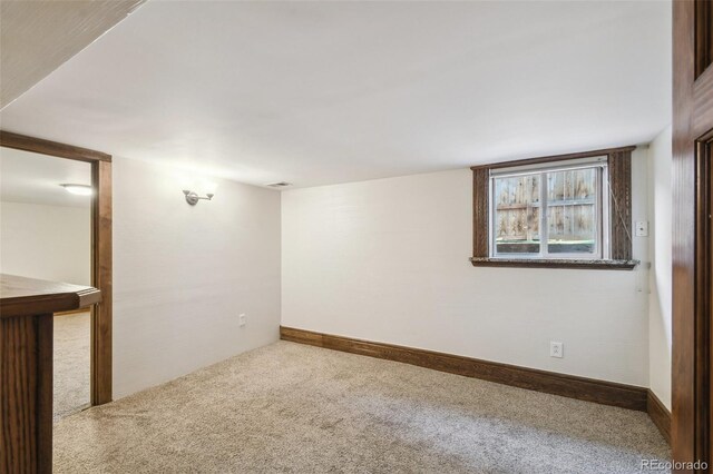 1633 Gaylord St, Denver, CO 80206 - carpeted spare room featuring baseboards