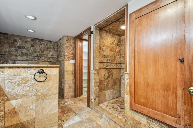 1633 Gaylord St, Denver, CO 80206 - bathroom with a walk in shower, tile walls, recessed lighting, and stone finish flooring