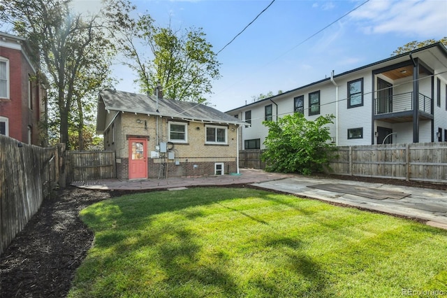 1633 Gaylord St, Denver, CO 80206 - back of house with brick siding and a patio