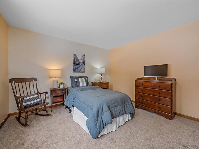 carpeted bedroom with baseboards