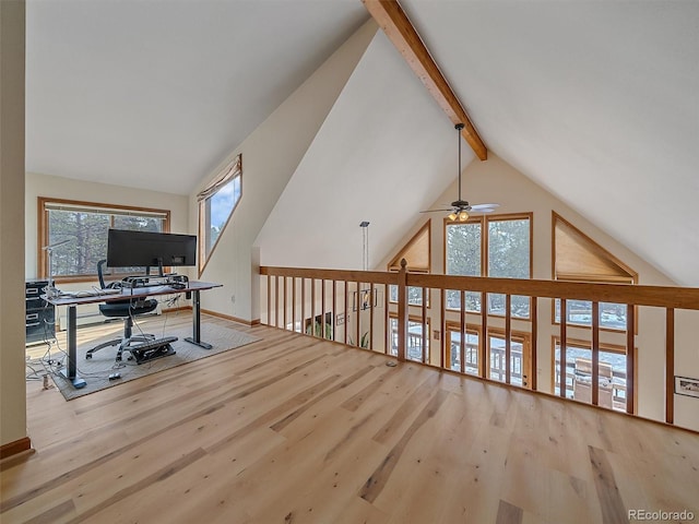 home office featuring beam ceiling, wood finished floors, baseboards, and high vaulted ceiling