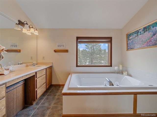 full bathroom with vanity, vaulted ceiling, a bath, and tile patterned floors