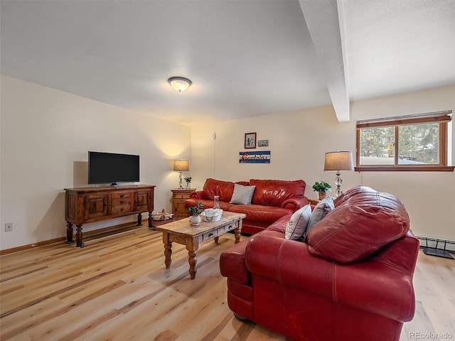 living room featuring baseboards, beam ceiling, and light wood-style flooring