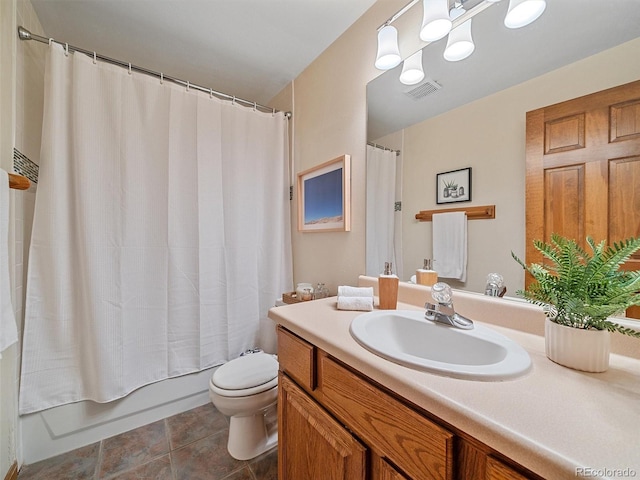 full bath featuring vanity, visible vents, shower / bath combo with shower curtain, tile patterned floors, and toilet