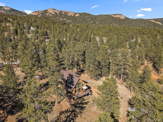 bird's eye view featuring a view of trees and a mountain view