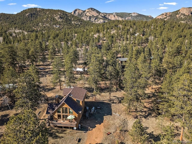 aerial view featuring a mountain view and a view of trees