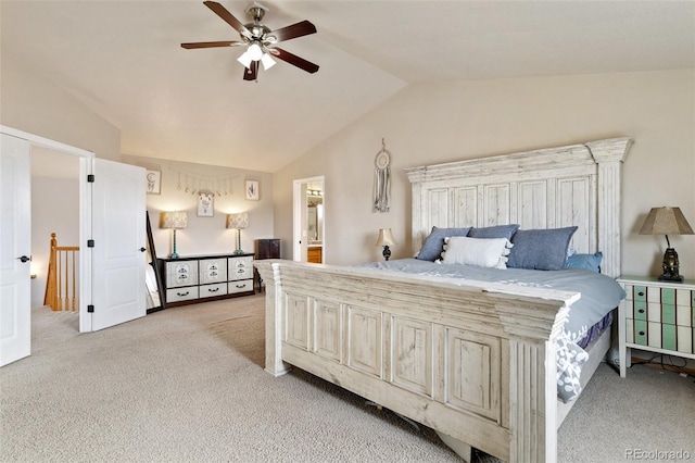 carpeted bedroom with vaulted ceiling and ceiling fan