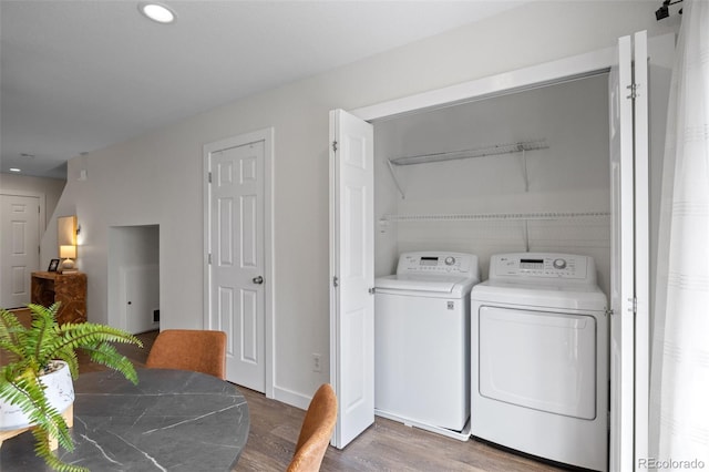 11845 W Tulane Dr, Morrison, CO 80465 - laundry room featuring washing machine and dryer, wood finished floors, and recessed lighting