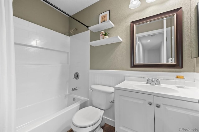 11845 W Tulane Dr, Morrison, CO 80465 - bathroom featuring vanity, washtub / shower combination, wainscoting, and a textured wall