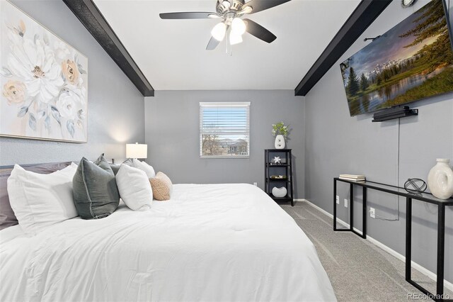 bedroom featuring carpet floors, baseboards, ceiling fan, and beam ceiling