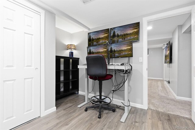 office space with baseboards, recessed lighting, wood finished floors, and visible vents