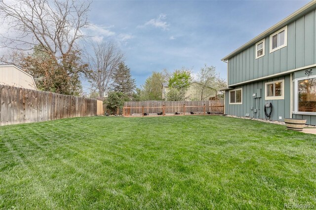 view of yard with a fenced backyard