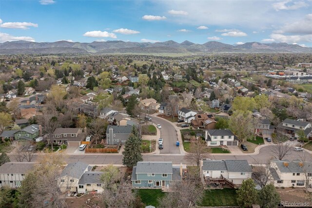 birds eye view of property with a residential view and a mountain view