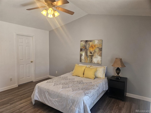 bedroom with ceiling fan, dark hardwood / wood-style floors, and lofted ceiling