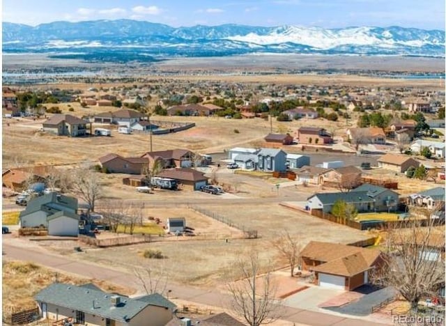 drone / aerial view featuring a mountain view