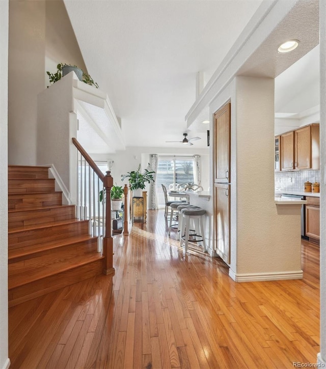 interior space featuring ceiling fan and light hardwood / wood-style flooring