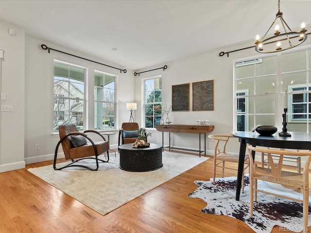 2880 Emporia Ct, Denver, CO 80238 - sitting room with a chandelier, wood finished floors, and baseboards