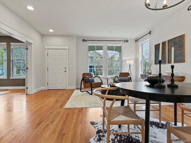 2880 Emporia Ct, Denver, CO 80238 - dining area featuring light wood-type flooring, recessed lighting, baseboards, and a chandelier