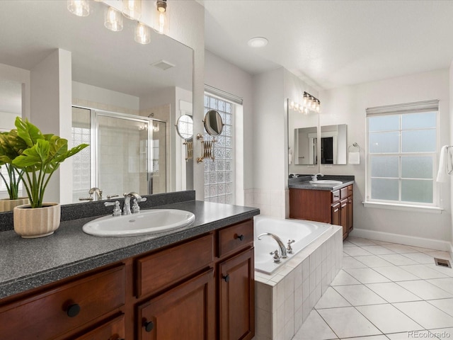 2880 Emporia Ct, Denver, CO 80238 - bathroom with a stall shower, a bath, tile patterned flooring, and two vanities