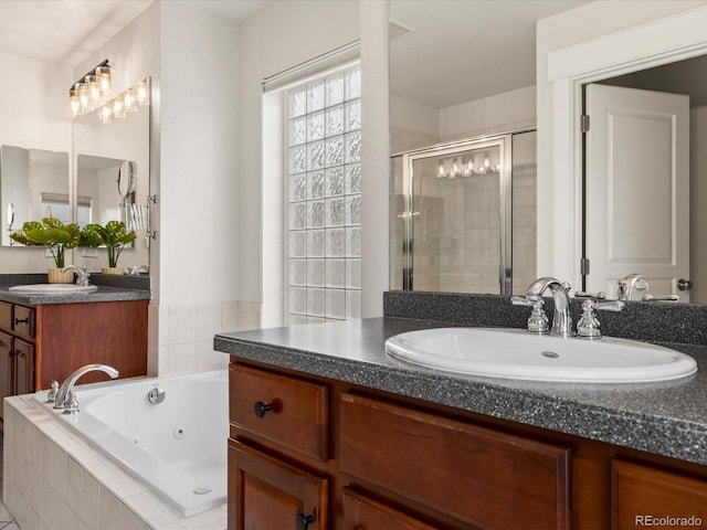 2880 Emporia Ct, Denver, CO 80238 - bathroom featuring a stall shower, a tub with jets, and two vanities