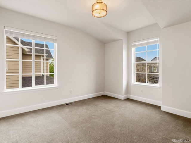 2880 Emporia Ct, Denver, CO 80238 - carpeted spare room featuring baseboards and vaulted ceiling