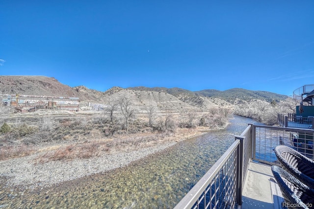 view of mountain feature with a water view