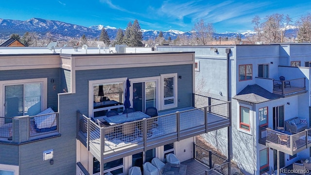 rear view of house with a mountain view