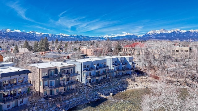 birds eye view of property featuring a mountain view