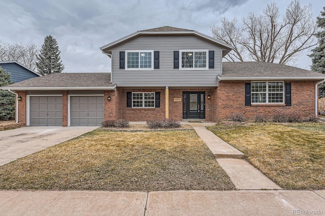 view of front of house with brick siding, an attached garage, and a front yard