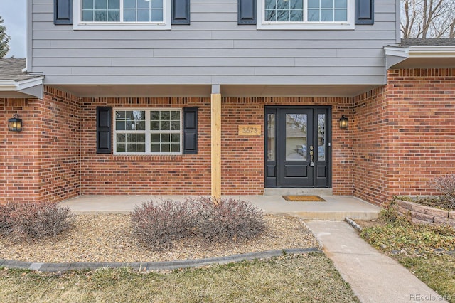 entrance to property with brick siding