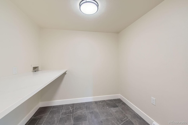 laundry room with laundry area, hookup for a washing machine, and baseboards