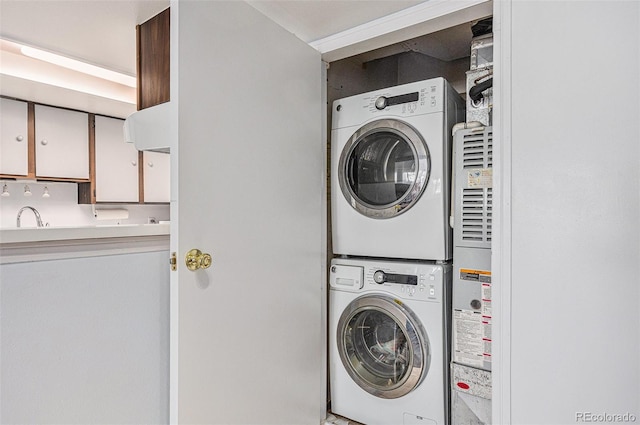17053 E Tennessee Dr Unit 212, Aurora, CO 80017 - laundry area featuring stacked washer / dryer