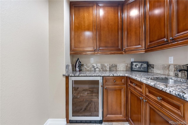 bar featuring a sink and wine cooler