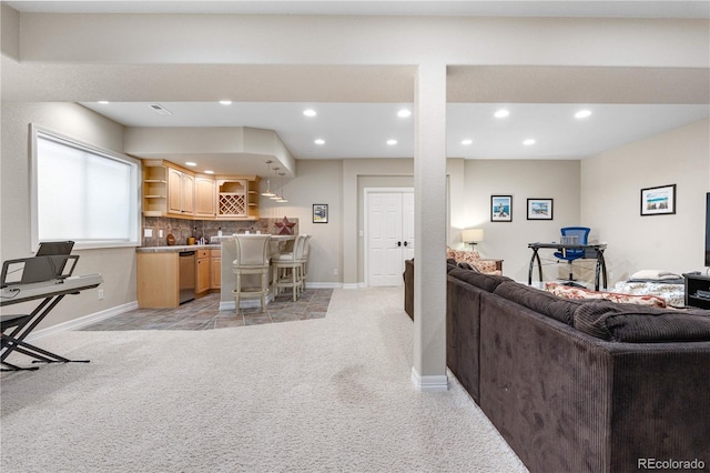 living area with indoor bar, recessed lighting, baseboards, and light carpet